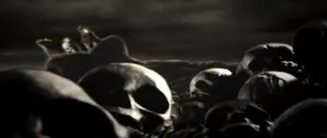 Dark, atmospheric scene featuring numerous scattered skulls against a shadowy background, evoking themes of mortality.