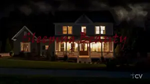 A beautifully lit house at night, with dark clouds above, featuring the text "Haunting Beauty" in bold red.