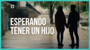 Couple holding hands on a rainy street, highlighting themes of love and anticipation for parenthood in a cinematic setting.