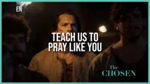 Dramatic scene from "The Chosen" featuring characters focused on a profound moment of prayer and reflection.