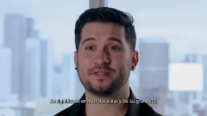 Man speaking confidently in front of a city skyline, sharing insights about personal growth and significance.