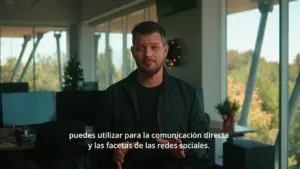 Man speaking in an office, discussing direct communication and social media aspects, with a modern workspace background.