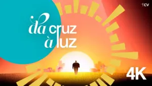 Colorful sunrise with a silhouette walking towards the light, featuring bold text "da cruz à luz" in a vibrant design. 4K quality.