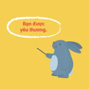 Cute gray rabbit holding a wand on a bright yellow background, accompanied by the text "Bạn được yêu thương."