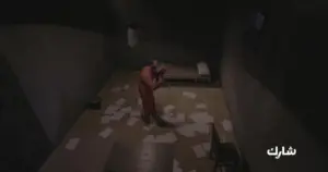 A dimly lit prison cell with scattered papers, featuring a solitary figure in an orange jumpsuit.