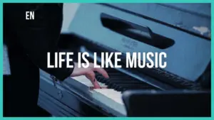 Close-up of a hand playing piano keys with the text "Life is Like Music" overlaid on a blue background.