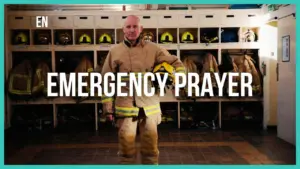 Firefighter stands confidently in a locker room, showcasing safety gear with bold text reading "Emergency Prayer."