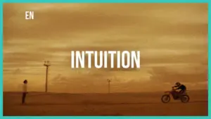 A motorcyclist rides towards a person in a vast desert landscape under a golden sky with the word "INTUITION" prominently displayed.