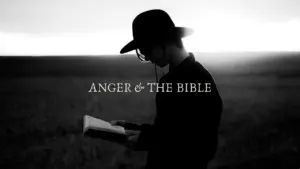 Silhouette of a person in a black hat reading a book against a dramatic sky, titled "Anger & The Bible."