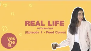 Gloria hosts "Real Life" episode on food, holding coffee against a bright yellow background with playful graphics.