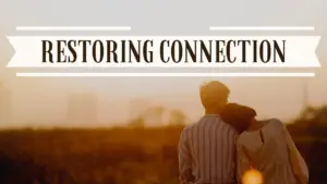 Couple standing together at sunset, symbolizing love and reconnection with the text "Restoring Connection" above them.