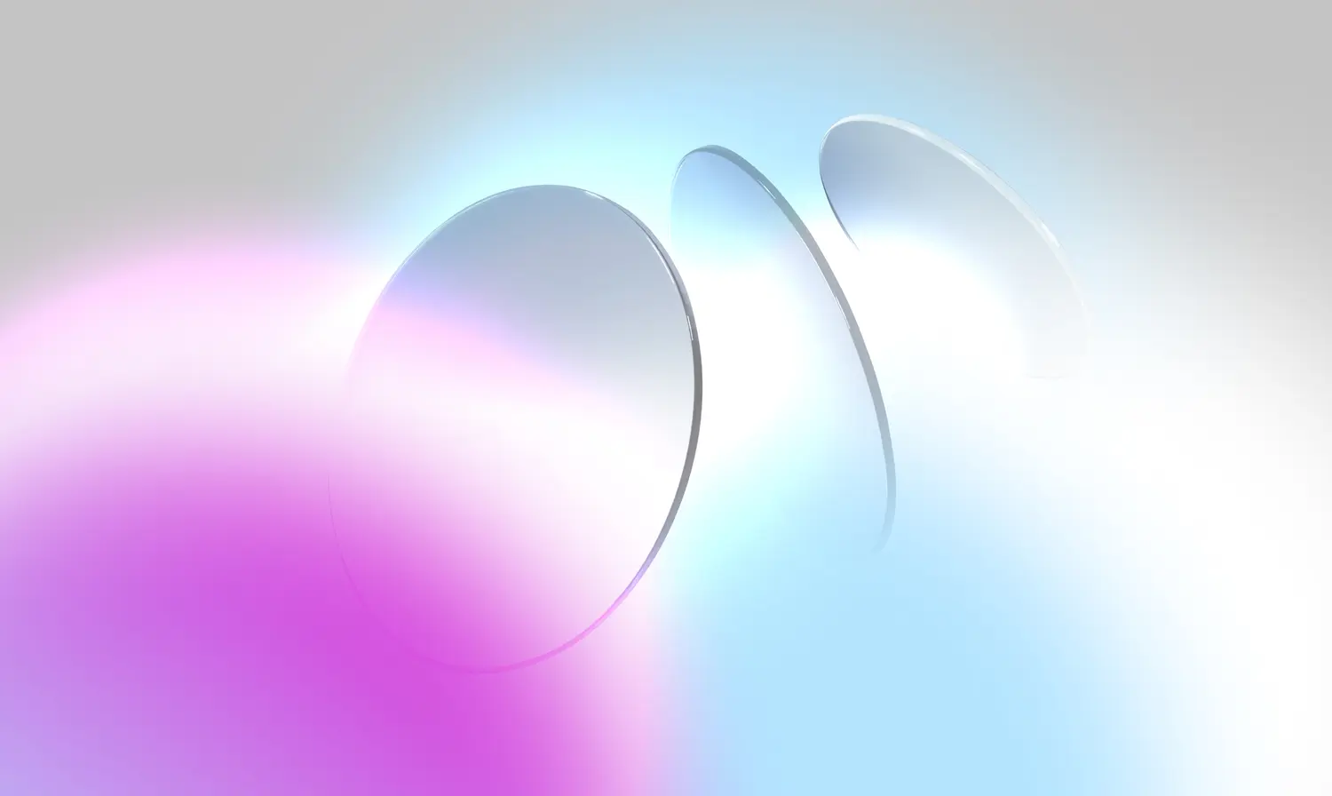 Abstract image of three translucent circles in a colorful gradient of blue and pink, symbolizing depth and light.